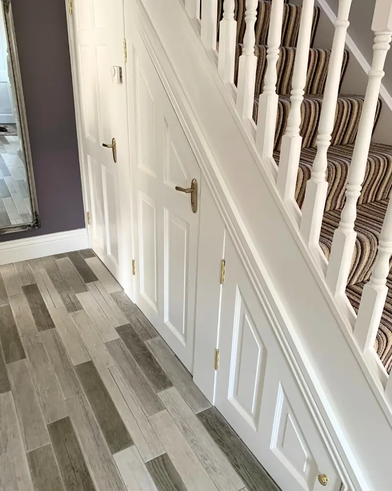 White storage cupboards with panelling