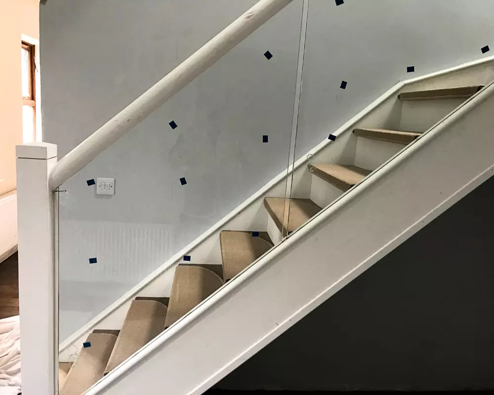 wood stairs with glass banister